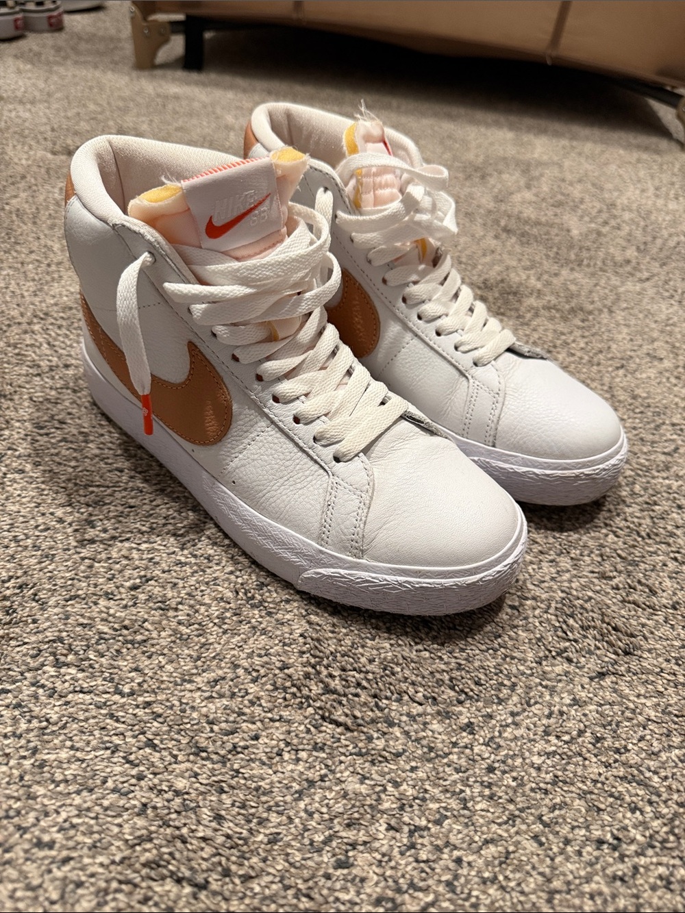 Nike Women’s White High-Top Sneakers with Tan Swoosh and Orange Accents